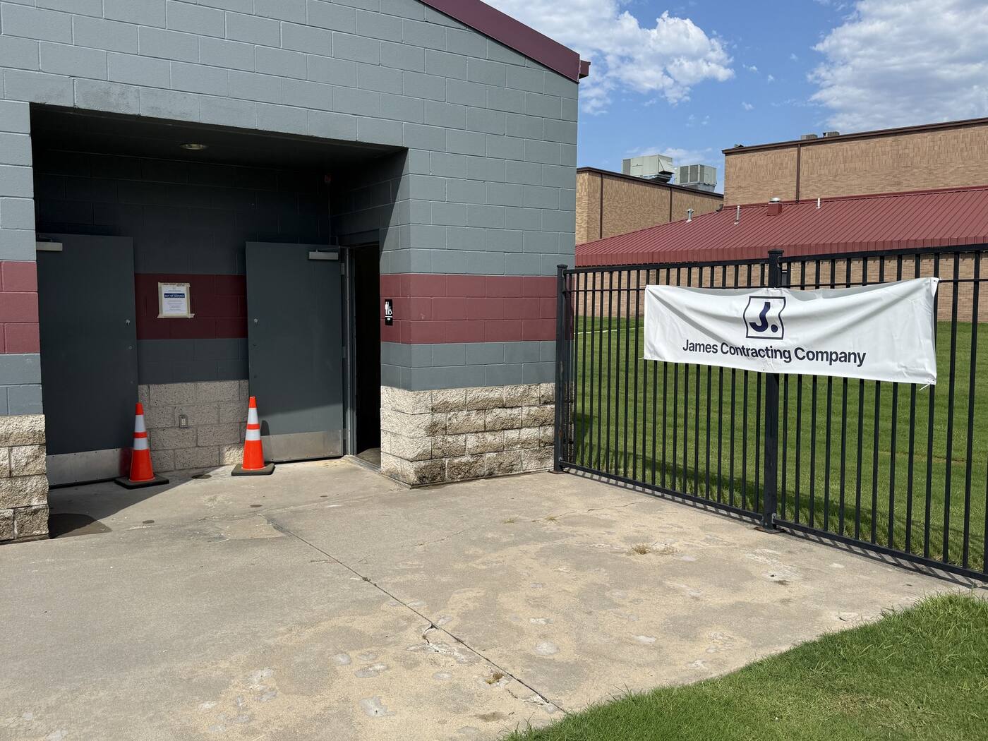 Baseball and softball concessions building with James Contracting Company banner